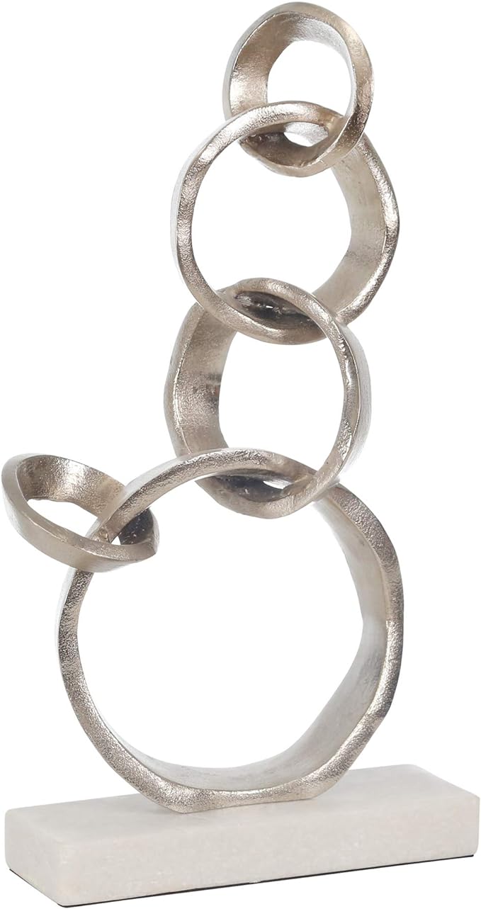 Linked Silver Rings On Marble Base