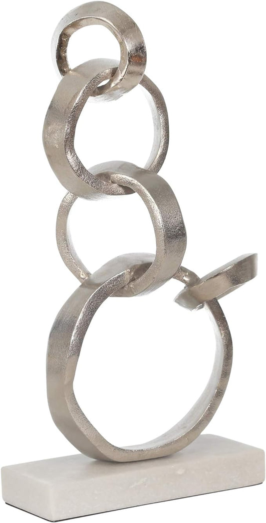 Linked Silver Rings On Marble Base